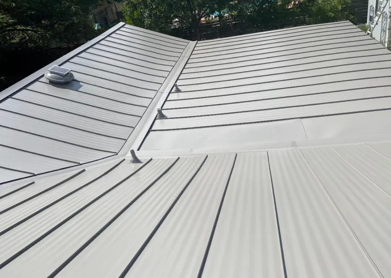 Solar attic fan installed on a metal roof for Roof Ventilation in Ladera Ranch